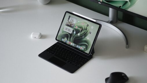 Ipad with keyboard sitting on white desk